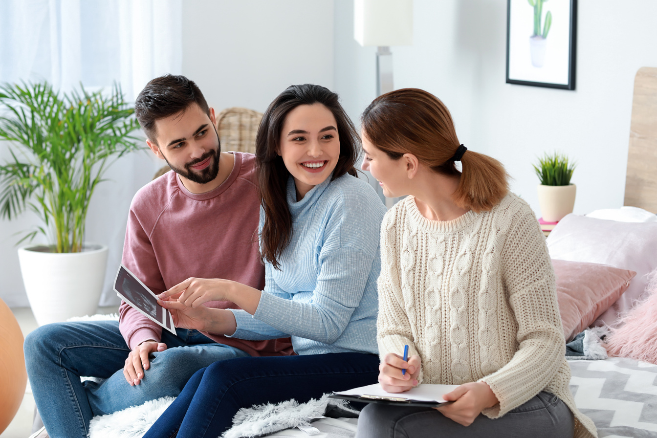 Pregnant Couple and Doula with Ultrasound Scans at Home